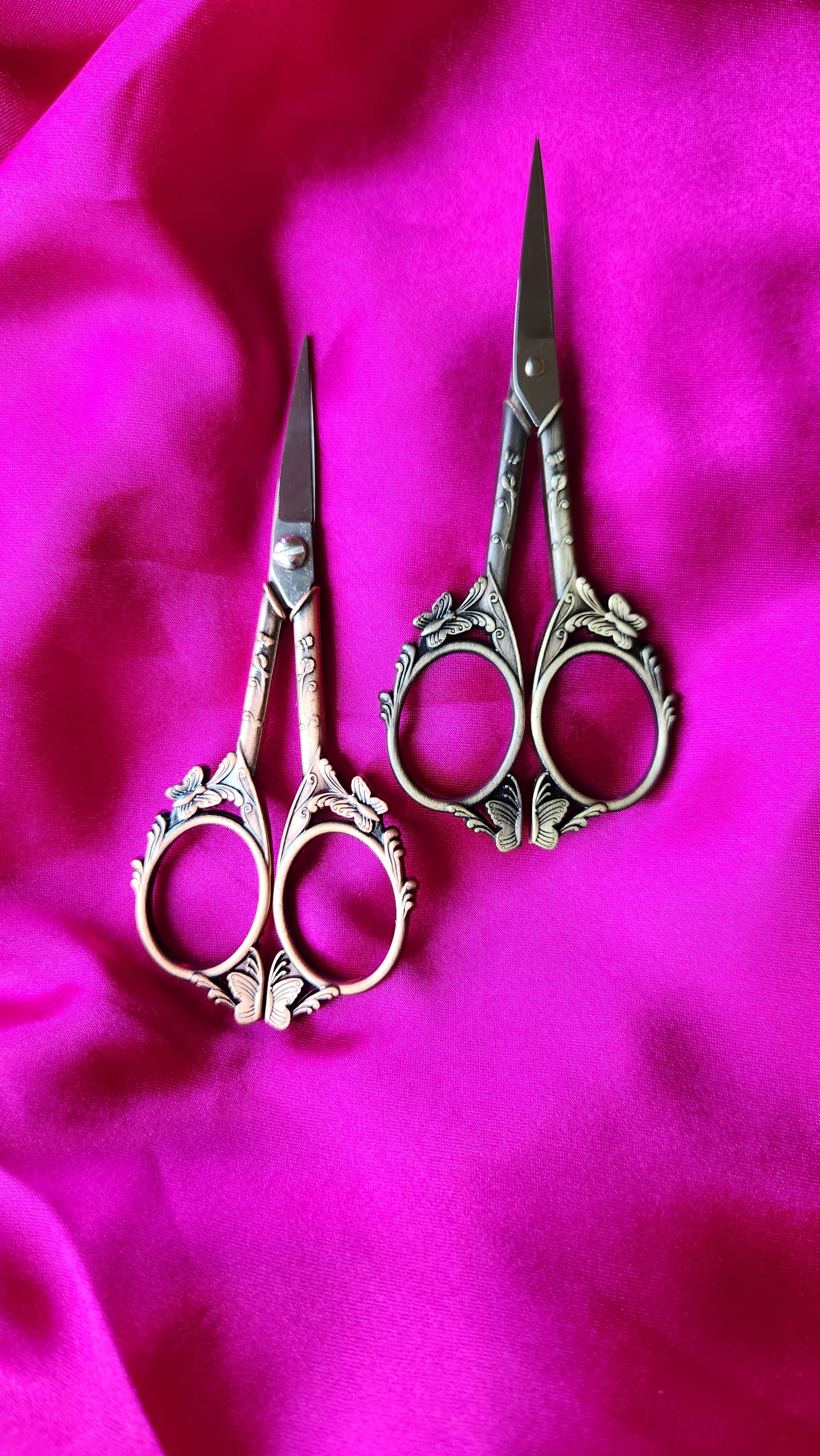 Gold and rose gold embroidery scissors with butterfly details